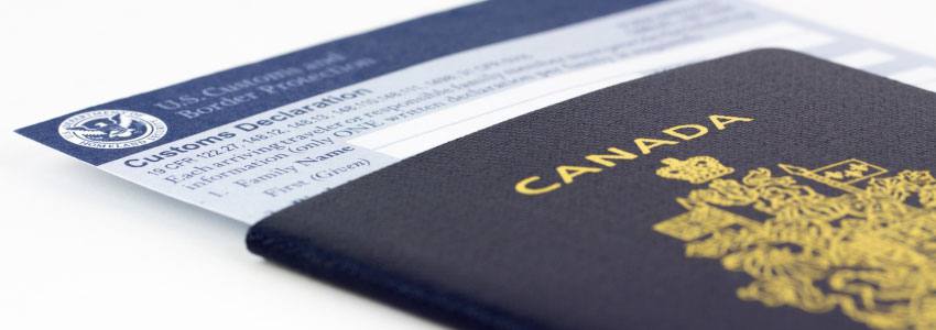 A canadian passport with declaration papers inside it