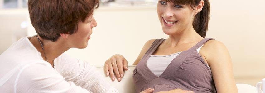 Midwife assisting expectant mother