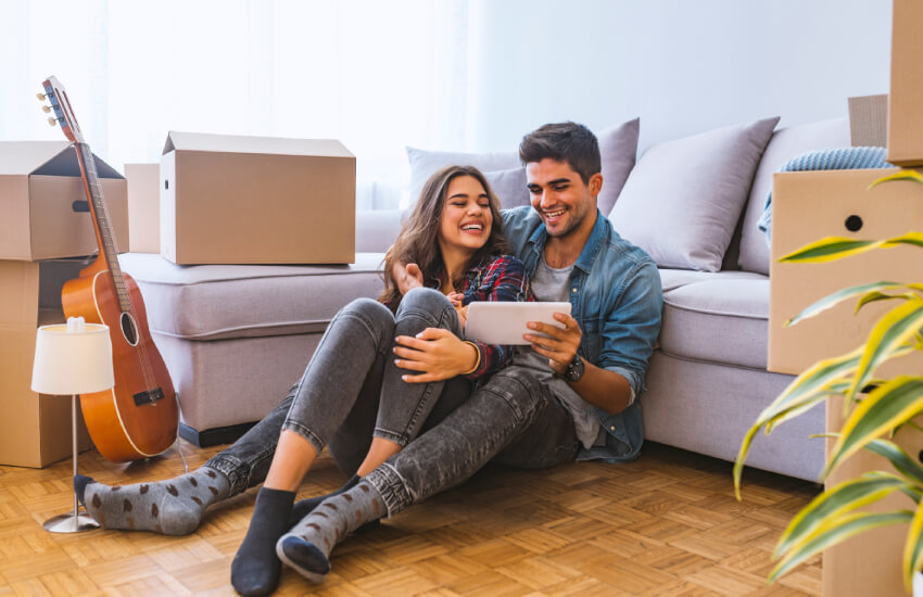 Happy couple discussing design of new appartment