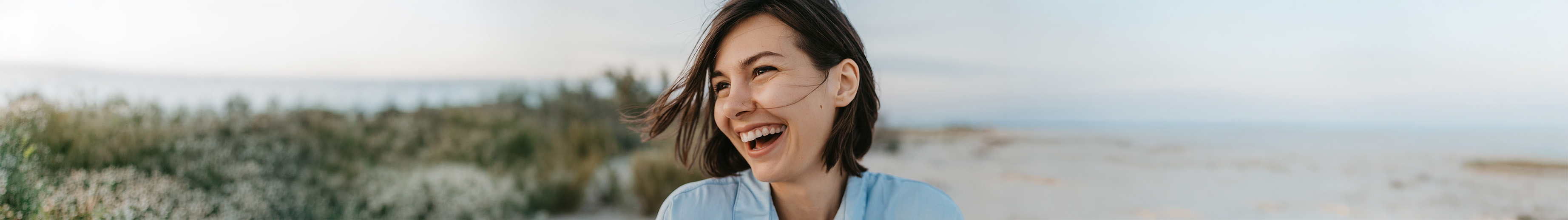 Candid portrait of a smiling, laughing woman. 
