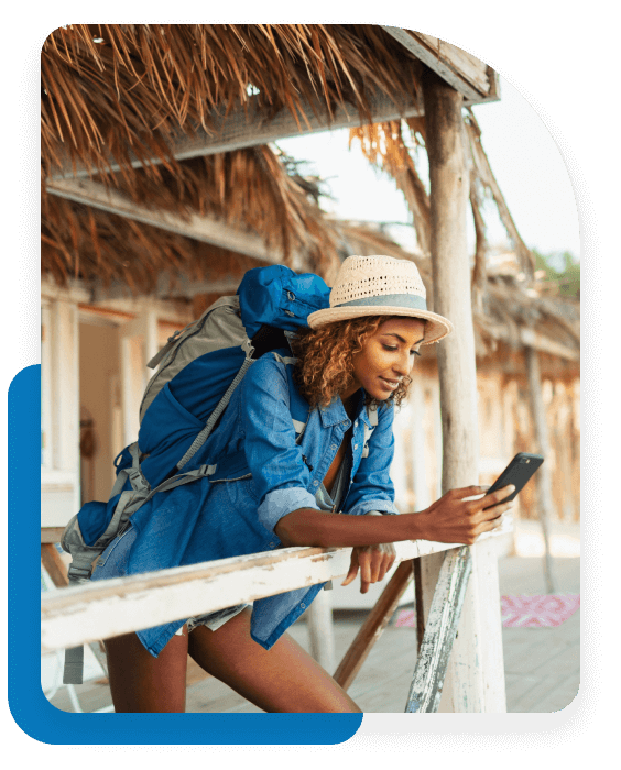 Woman on vacation with backpack looking at her phone